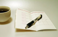 コーヒーとペンとスケジュール帳